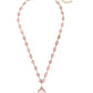 Gold chain with pink beads, central pink four-leaf clover pendant, adjustable clasp. Sizes available: S, M, L.