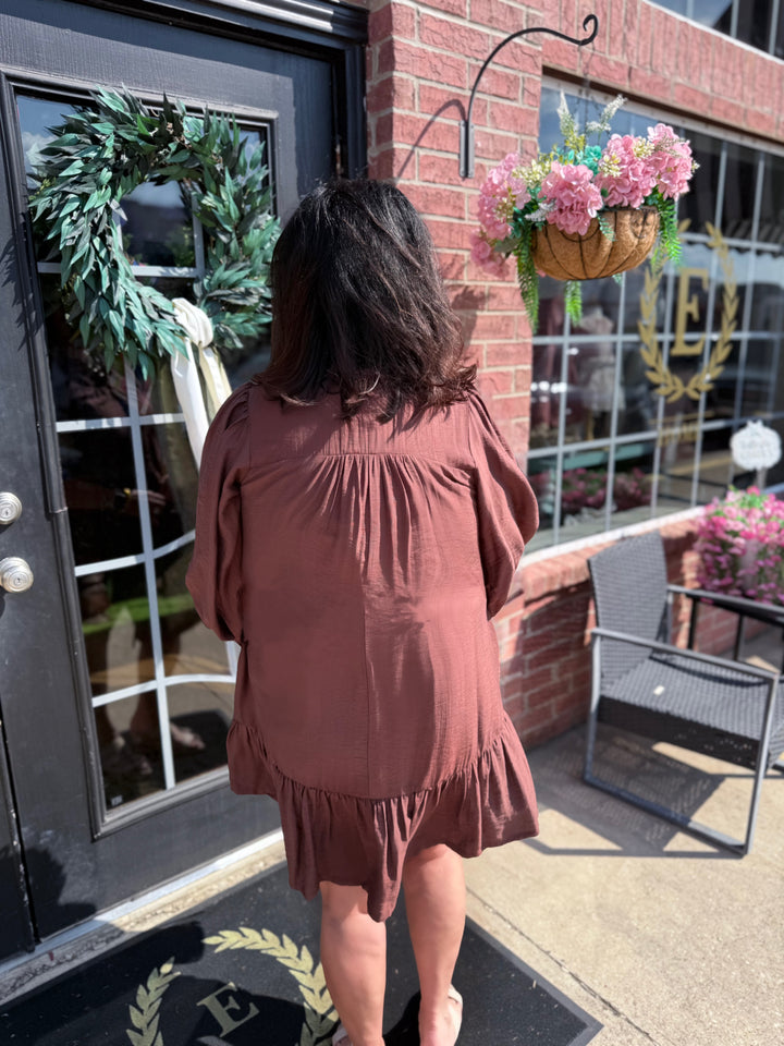 Smocked Ruffle Tiered Mini Dress with ruffled tiers and smocked bodice; available in sizes XS-XL.