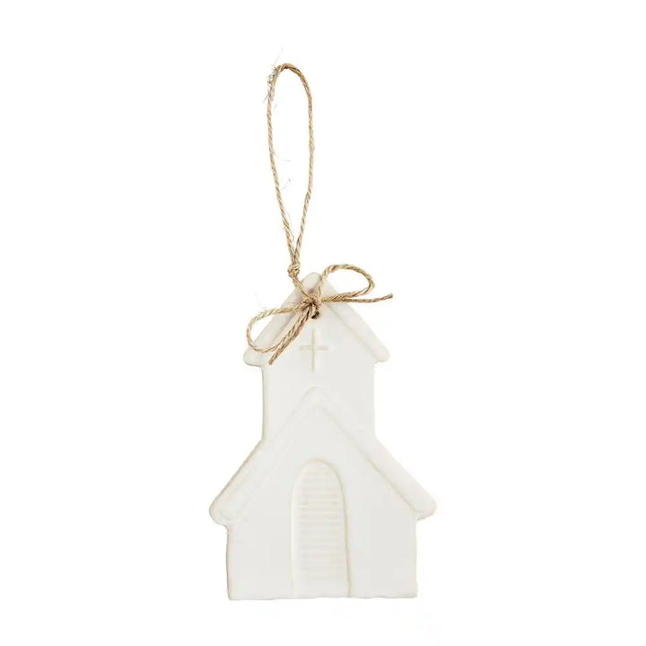 White stoneware church ornament with cross and jute hanging loop.