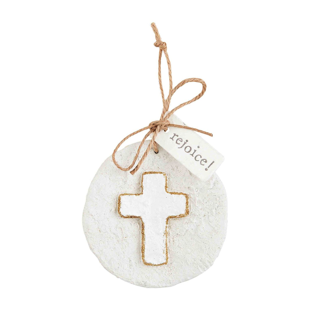 Round glitter papier-mâché ornament with cross, twine tie, and “rejoice!” tag.