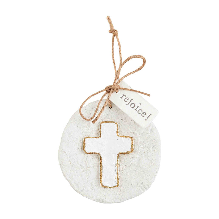 Round glitter papier-mâché ornament with cross, twine tie, and “rejoice!” tag.