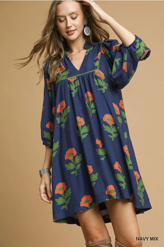 Kelly Navy Mix Dress: loose-fitting navy, red/green floral print, 3/4 sleeves, slight v-neck. Available in sizes XS-XL.