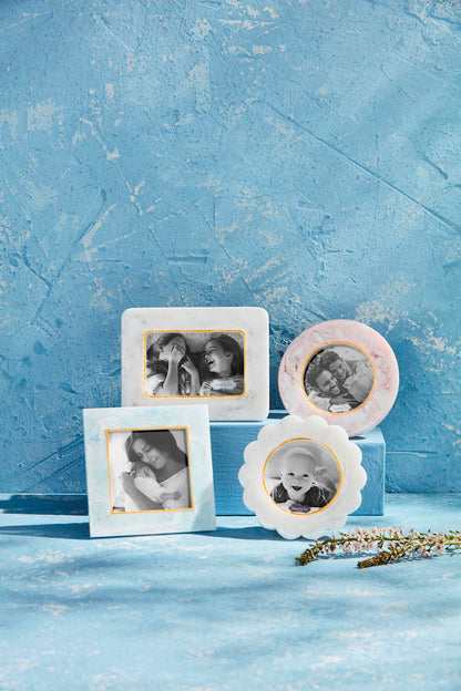 Set of photo frames with gold accents, each unique in shape and size. Sizes available: small resin frame included.