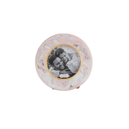 The Small Resin Frame features a round, marbled light pink and white design. Sizes available: Small.