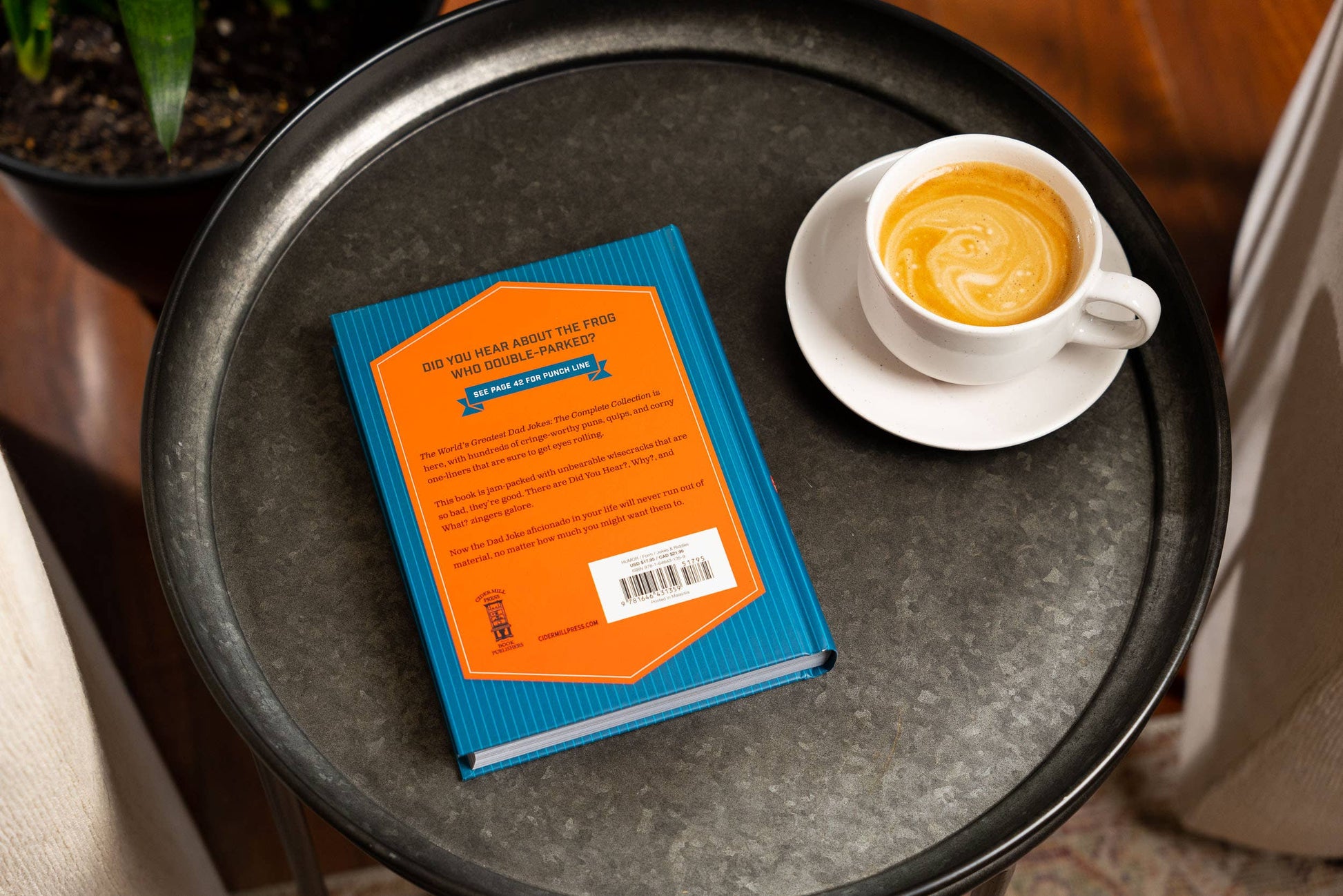 Hardcover "World’s Greatest Dad Jokes: The Complete Collection" with orange and blue cover. Sizes available: Standard.