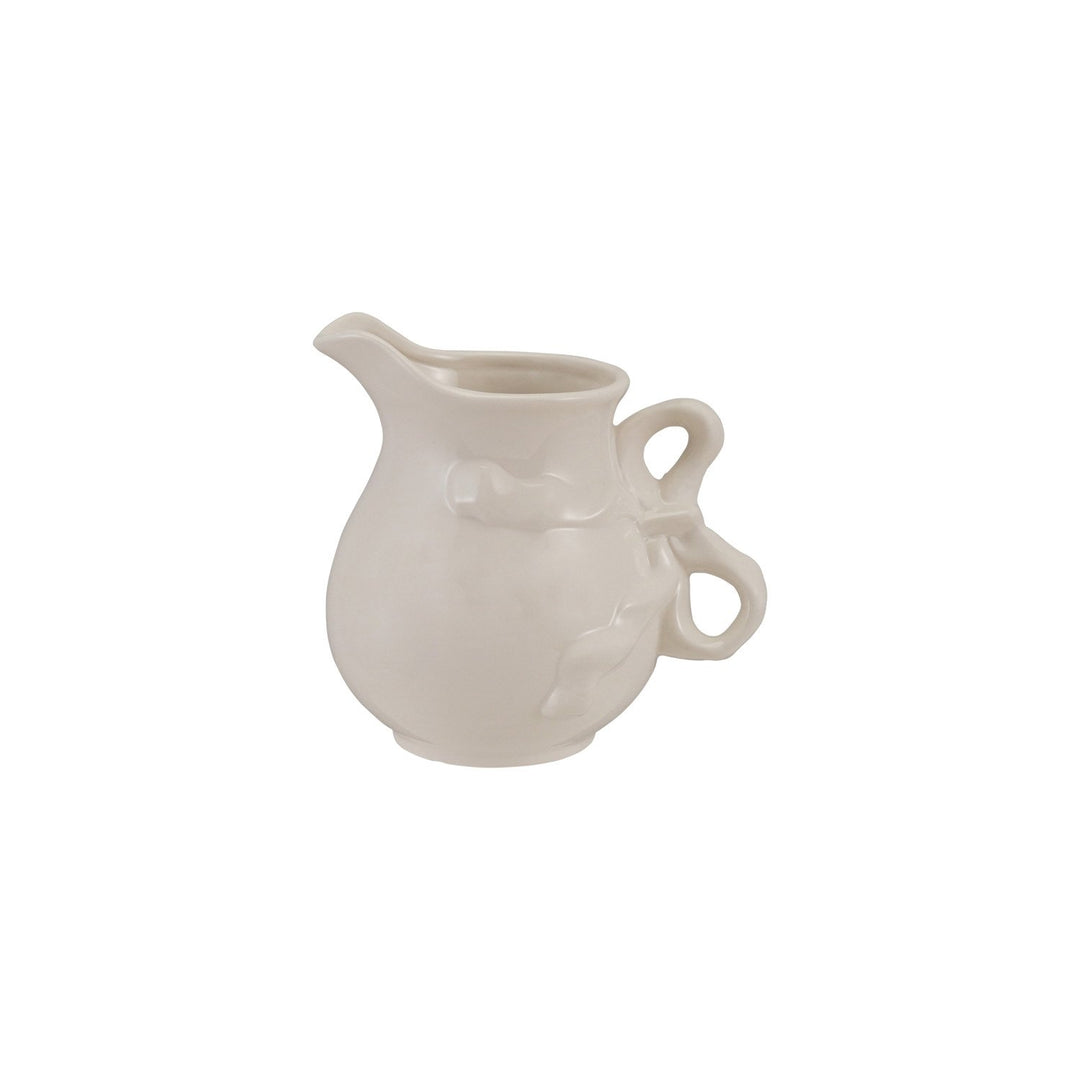 White stoneware pitcher with bow-shaped handle and subtle leaf details; available in multiple sizes.