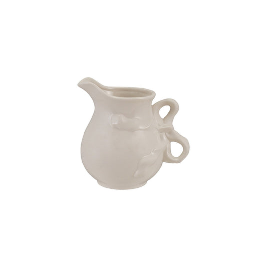 White stoneware pitcher with bow-shaped handle and subtle leaf details; available in multiple sizes.