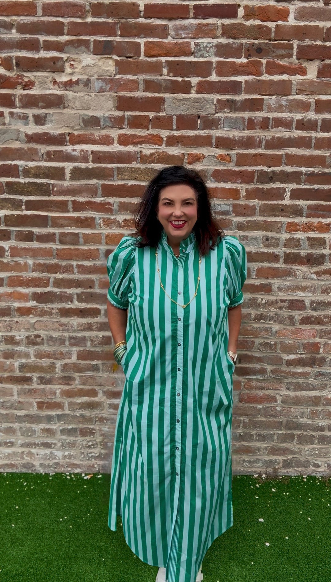 Green Stripe Ruffle Midi Dress in green and white vertical stripes with a button-front placket, ruffled collar, and puff sleeves. Available in Reg. & Plus.