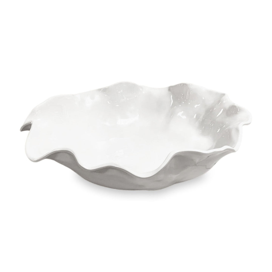 White ceramic bowl with wavy, flower-like rim; available in extra large size from the Beatriz Ball Havana Collection.