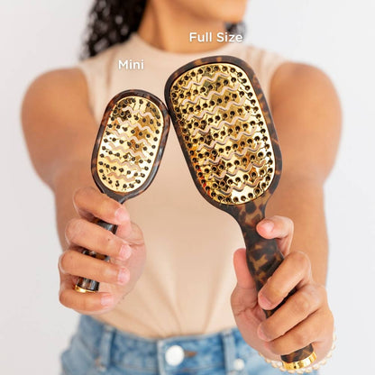 Mini Vented Brush | Tortoise shown in hand, highlighting its compact size. Available in mini size.