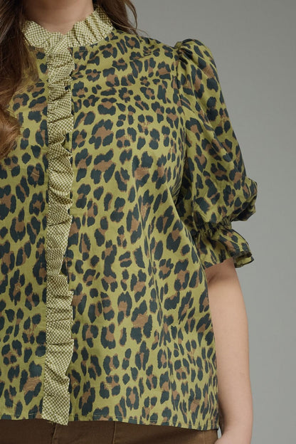 Olive Leopard Puff Sleeve Ruffle Top with short puff sleeves, green and brown leopard print, ruffle details on the button line, and ruffle band collar; available in sizes XS-XL.