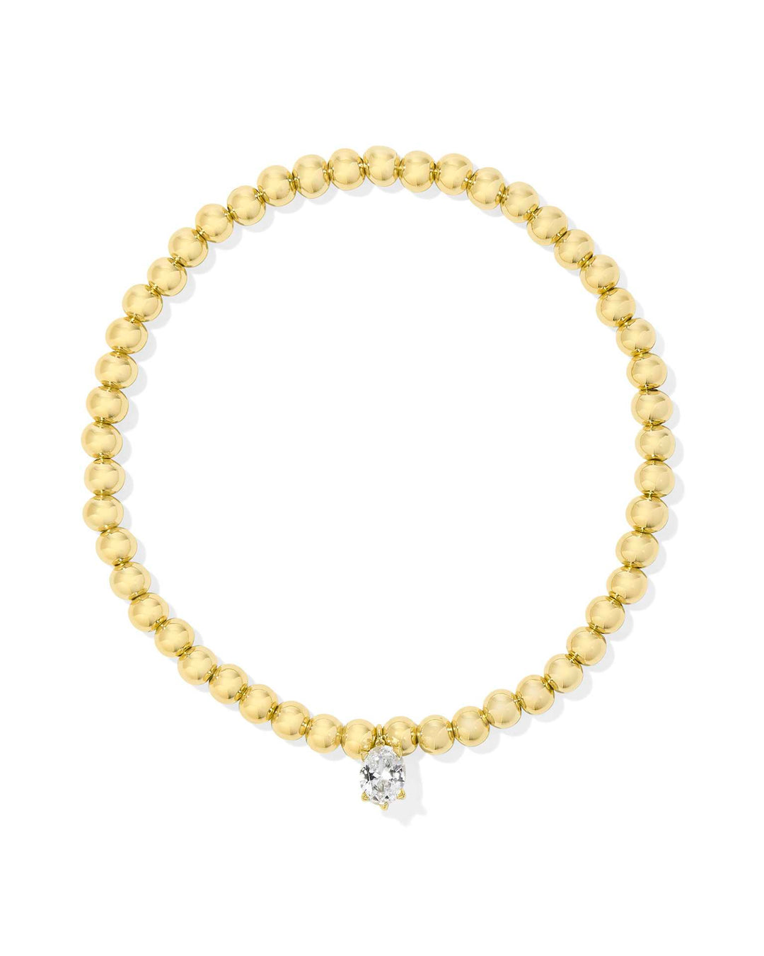 Gold beaded stretch bracelet with a single round white crystal charm at the center. Available in one size.