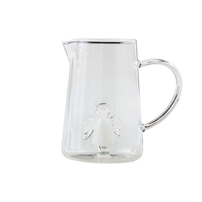 Clear glass bud vase with handle and small tinted angel figurine at base. Available in multiple sizes.