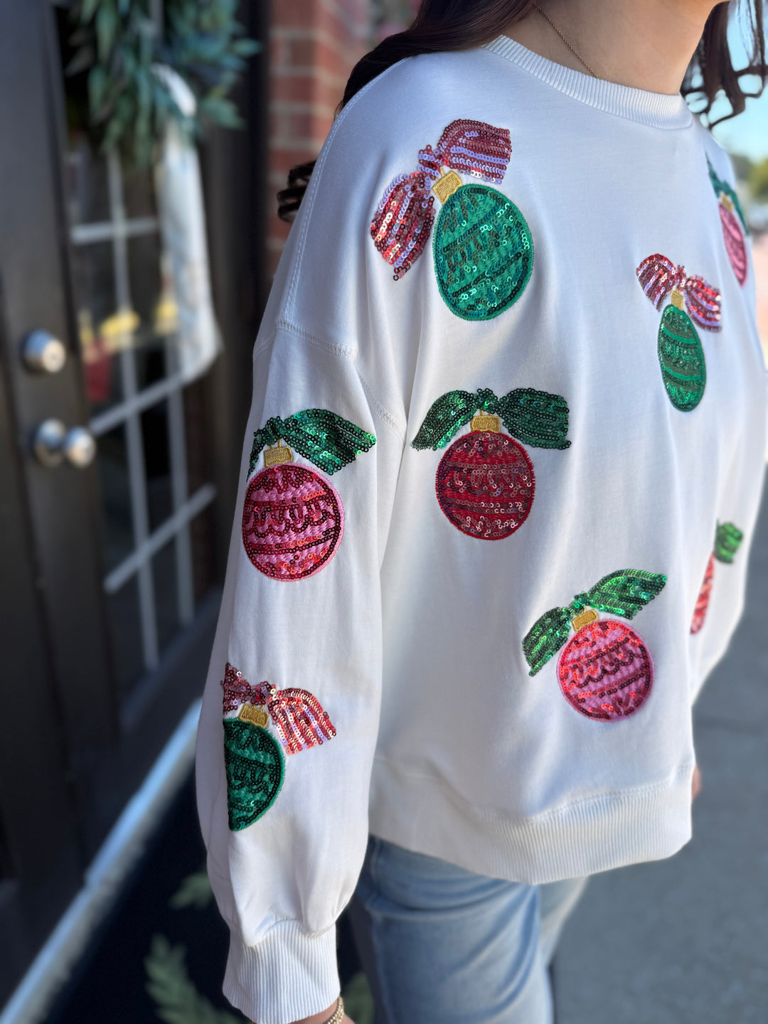 Millie Baubles &amp; Bows Sweatshirt, white crewneck with sequin ornaments and bows. Available in multiple sizes.