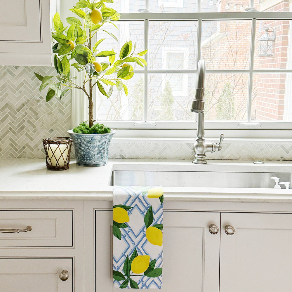 Bamboo Lemon Pattern Tea Towel, available in 16x28 and 20x30 inches, displayed over a white sink.