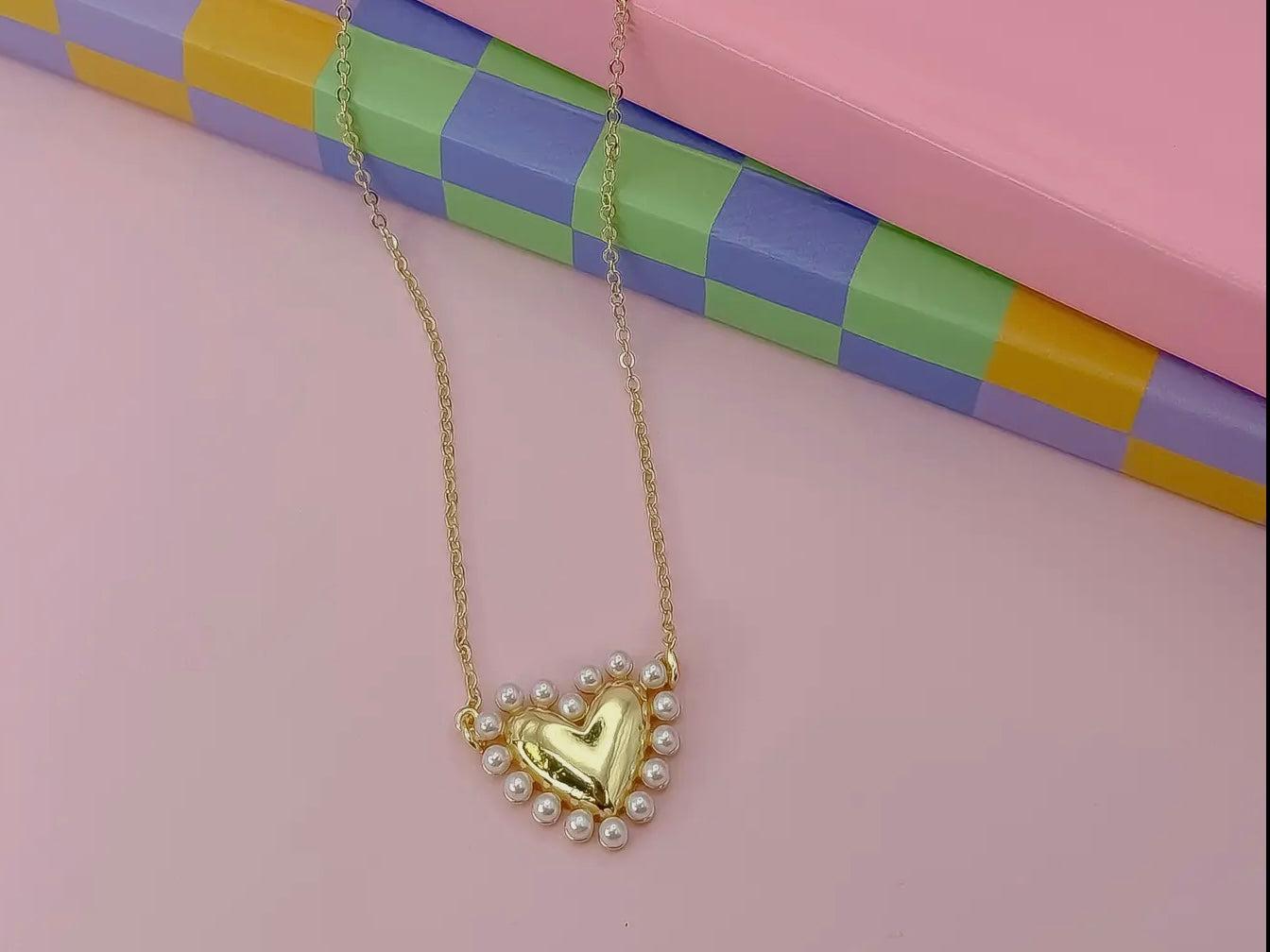 Love Gold Necklace: gold heart pendant with small pearls. Available in 16", 18", and 20" chain lengths.