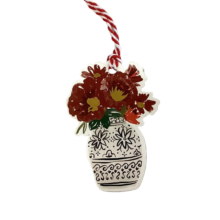 Vase-shaped Gift Tag Book holiday gift tag with dark red flowers and red and white baker’s twine.