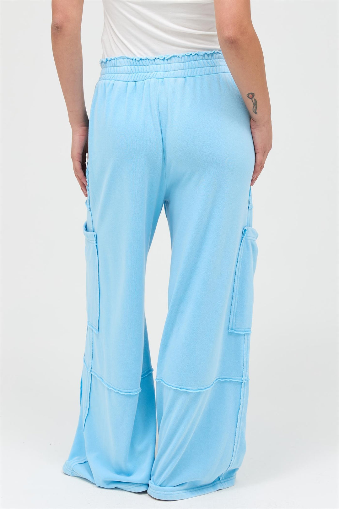 Mineral Wash Wide Leg Cargo Pants in light blue, high-rise with patch pockets. Available sizes: XS-XL.
