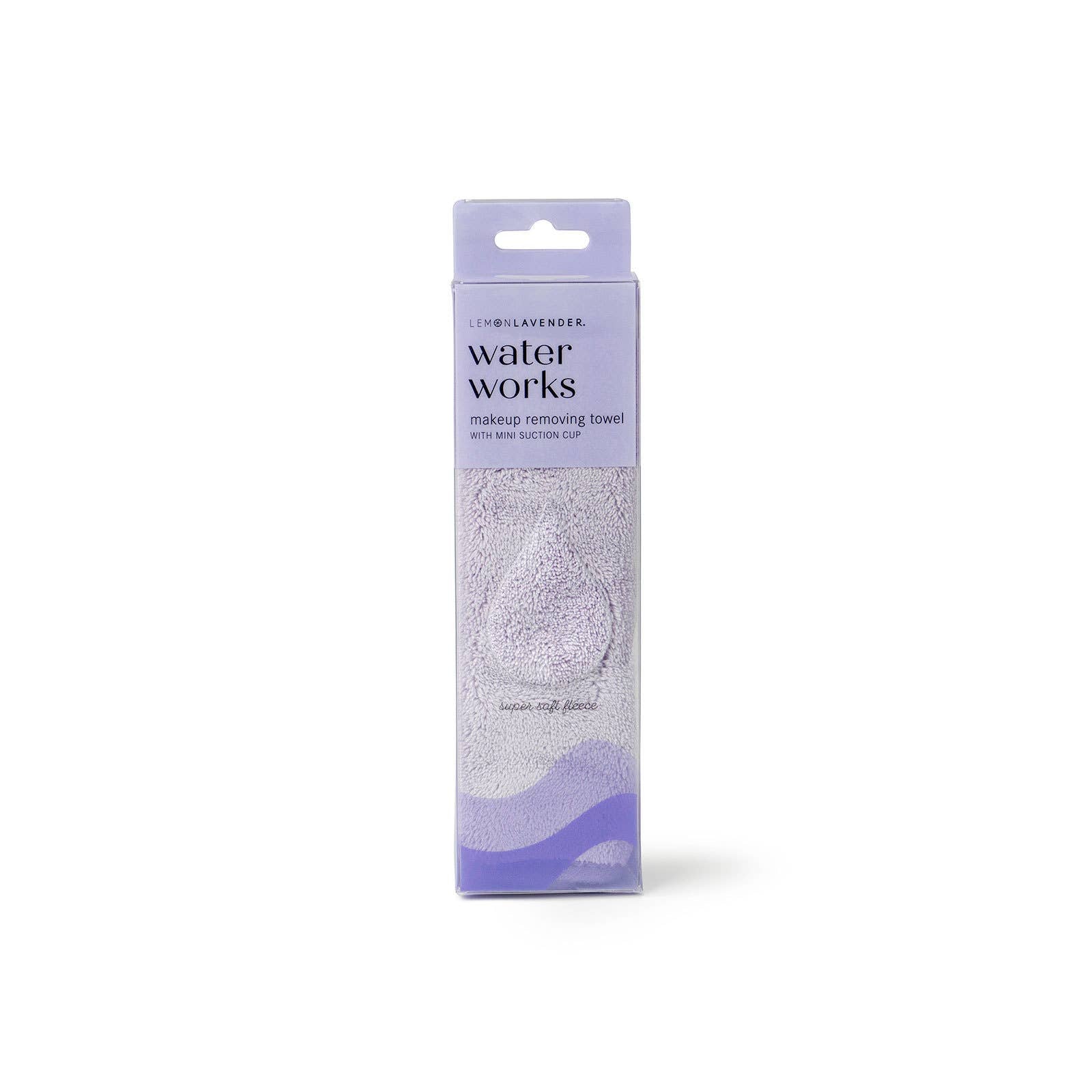 Lavender box labeled "Lemon Lavender Water Works Make-up Removing Towel" with a folded makeup remover towel; sizes available.