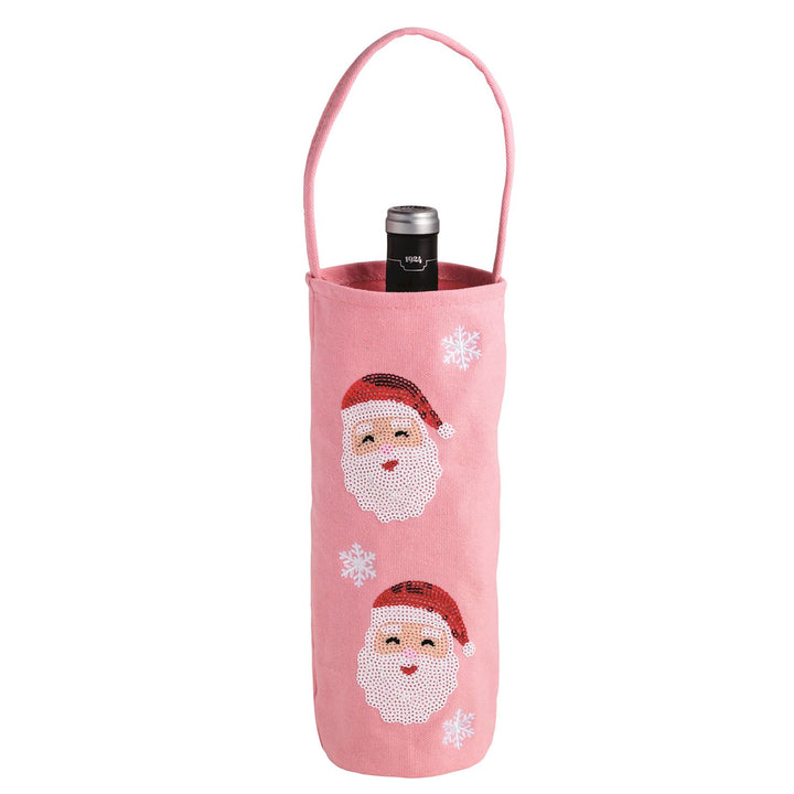 Holiday Sequin Wine Bag, pink fabric with handle, sequined Santa Claus faces, and embroidered snowflakes.