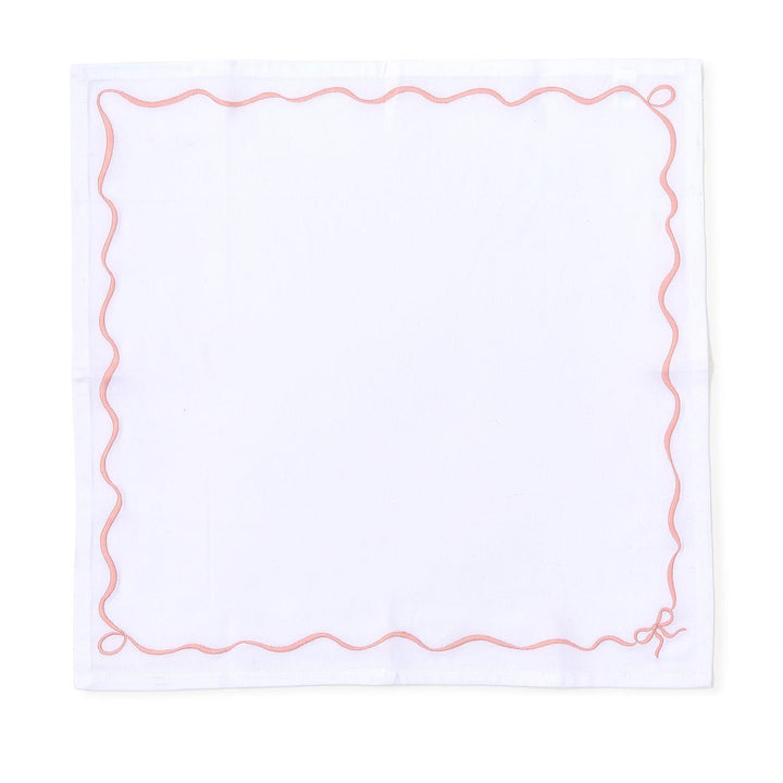 Set of 4 white cotton napkins with pink wavy border and small embroidered bow; available in 20" x 20" size.