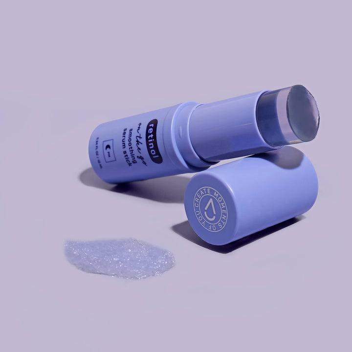 Plump Retinol Smoothing Serum Stick, 0.34 fl oz, open with clear gel balm visible and cap placed beside it.