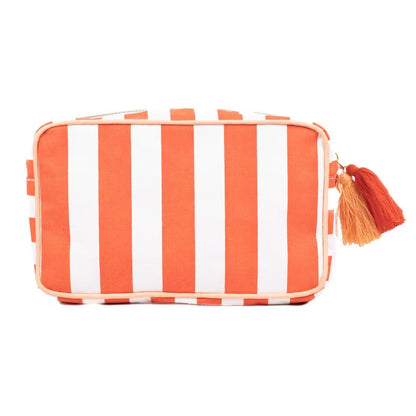 Cosmetics bag with bold vertical orange and white stripes, top zipper, two tassels. Laminated canvas. Sizes: S, M, L.