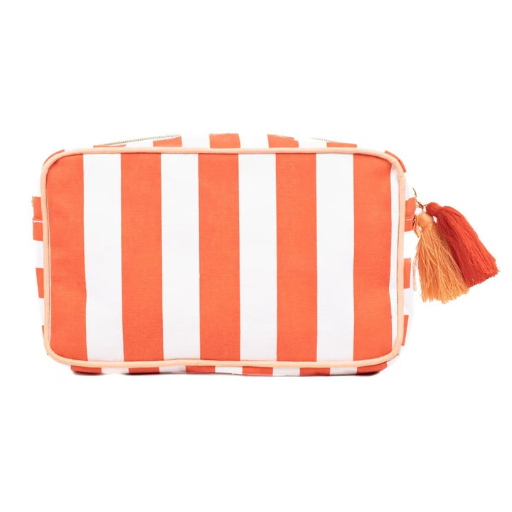 Cosmetics bag with bold vertical orange and white stripes, top zipper, two tassels. Laminated canvas. Sizes: S, M, L.