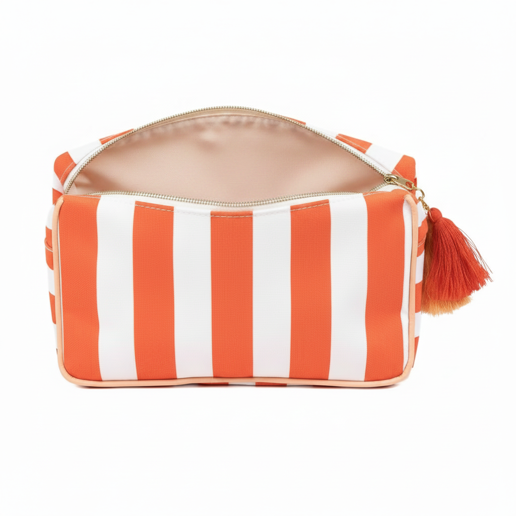 Fiesta and white striped Megan Cosmetic Bag, laminated canvas, beige interior, red-orange tassel. Sizes: S, M, L.