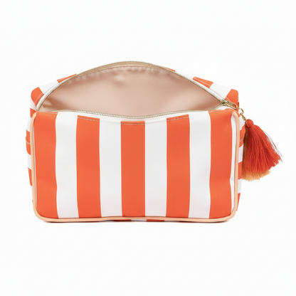 Fiesta and white striped Megan Cosmetic Bag, laminated canvas, beige interior, red-orange tassel. Sizes: S, M, L.