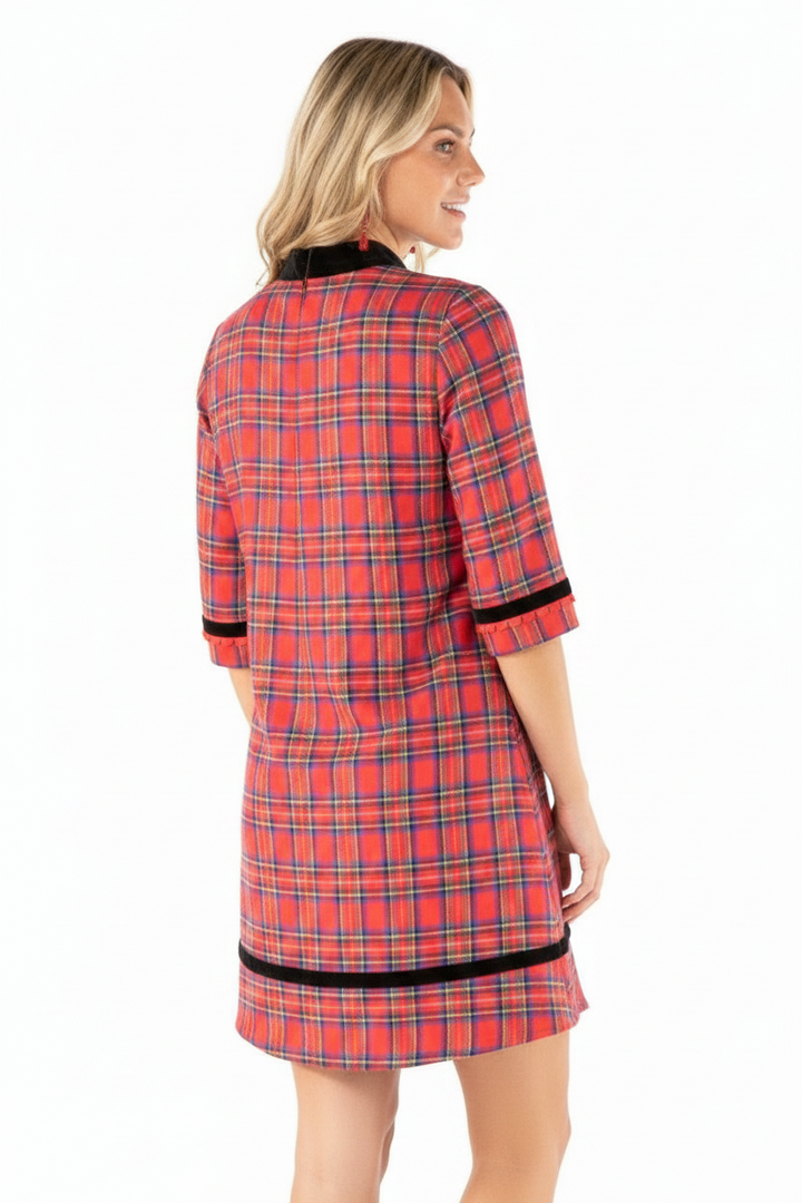 Red plaid velvet trim mini dress with black velvet collar, cuffs, and hem. Available in sizes XS-XL.