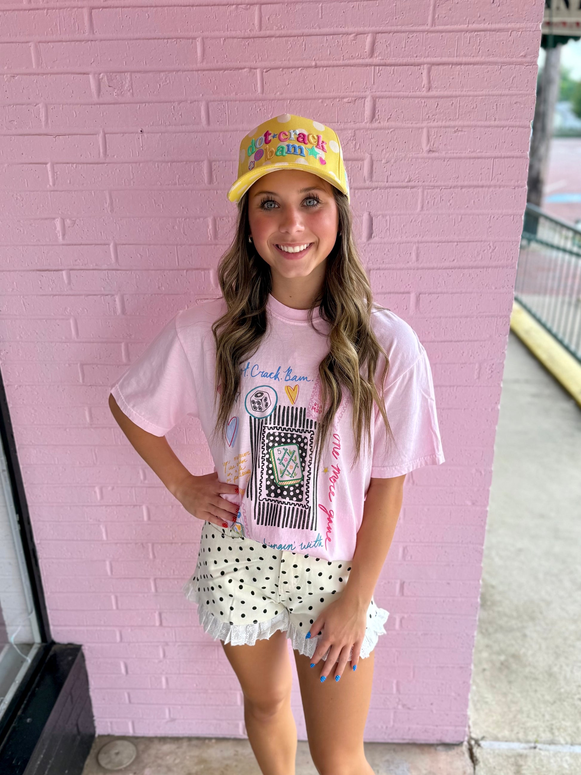 Mahjong Collage Tee with playful mahjong-inspired graphic. Available in sizes XS-XL.