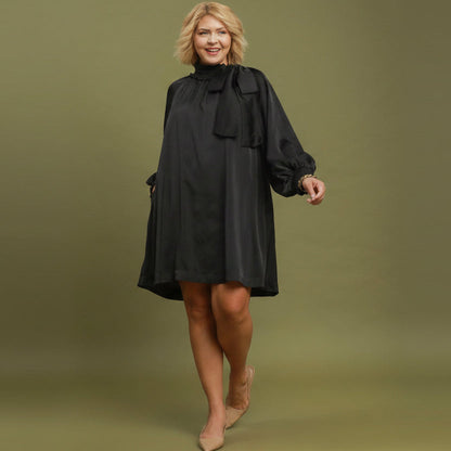 Black Satin Tie Neck Dress with long sleeves, loose fit, satin finish. Available in plus sizes.