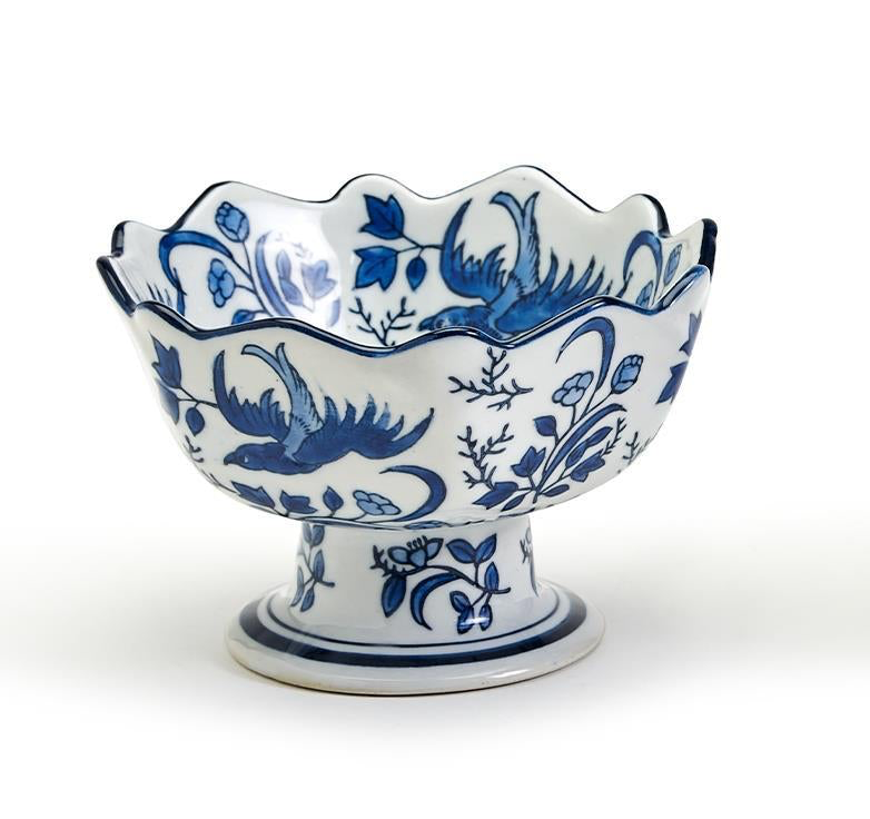 Hand-painted blue and white porcelain scalloped edge footed bowl with bird and floral patterns.