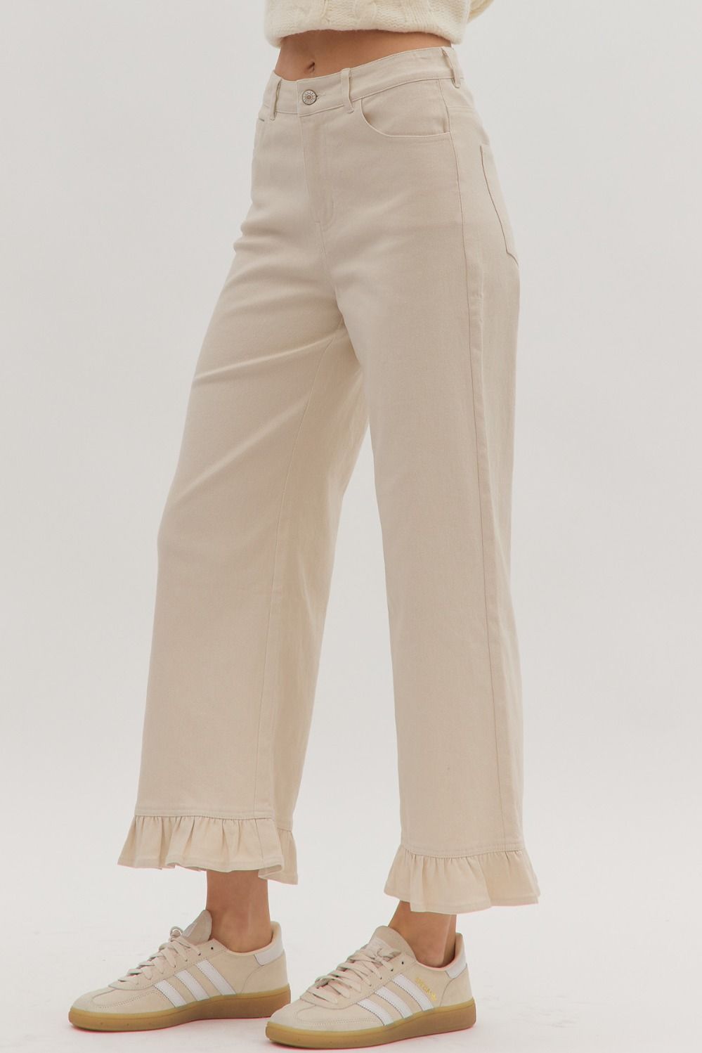 Leah Ruffle Trim Pants in cream cotton, available in sizes XS-XL. Features ruffle trim detail.