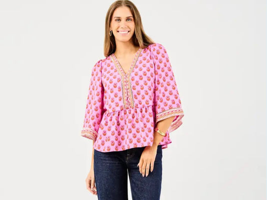Monroe Floral Foulard Top: pink floral, peplum silhouette, three-quarter sleeves. Available in XS–XL.