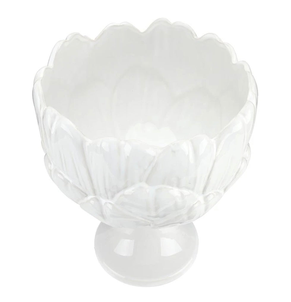 White ceramic bowl with scalloped, petal-inspired edges and a short pedestal base; glossy finish. Sizes available: small, medium, large.