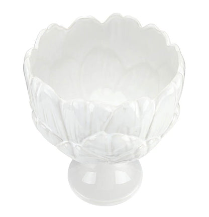 White ceramic bowl with scalloped, petal-inspired edges and a short pedestal base; glossy finish. Sizes available: small, medium, large.