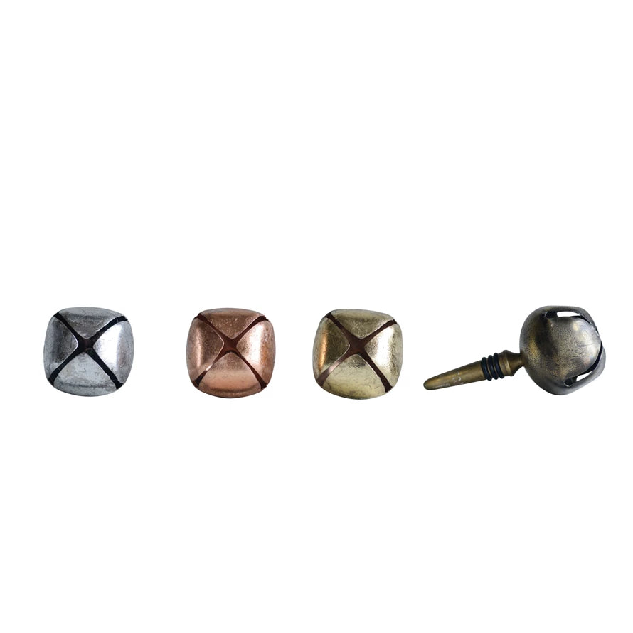 Silver, copper, and brass jingle bell bottle stoppers.