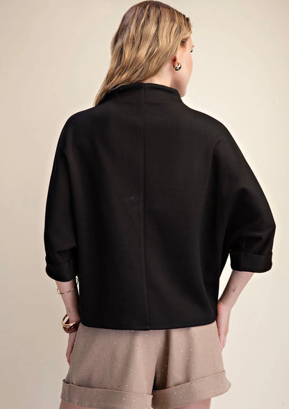 Everyday Mock Neck in black styled as a jacket; available in sizes XS–XL.