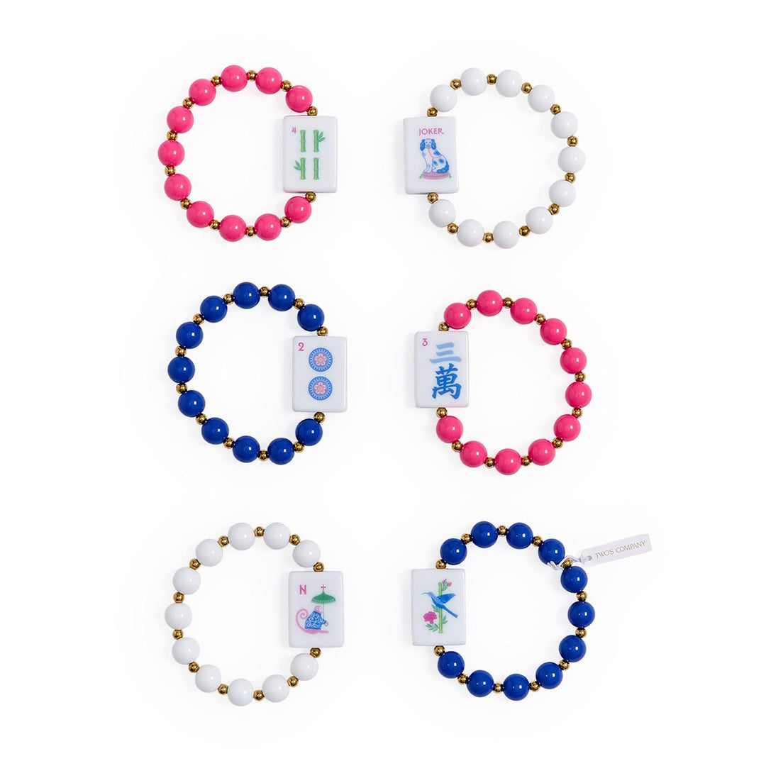 Six Mahjong Beaded Stretch Bracelets in pink, blue, and white with mahjong tile charms, colorful acrylic accents, and gold accent beads. Sizes available: one size fits most.