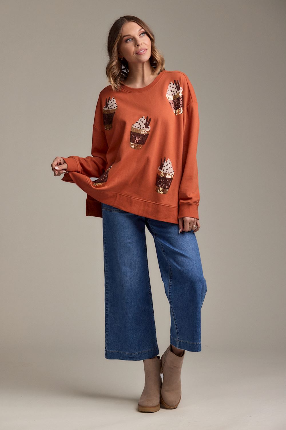 Pumpkin Spice Sweatshirt in bright orange with dessert graphics, available in sizes S-XL.