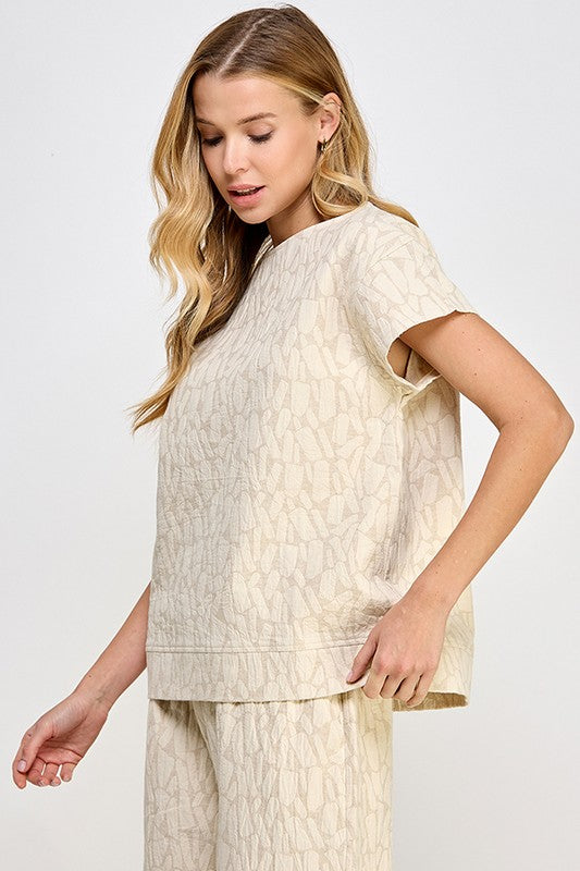 Jacquard Linen Lounge Set: short-sleeve beige top and matching abstract-pattern pants. Available in sizes XS–XL.