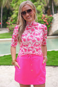 Solid Neon Pink Skort; available in sizes XS-XL. Features a bright neon pink color and simple, streamlined design.