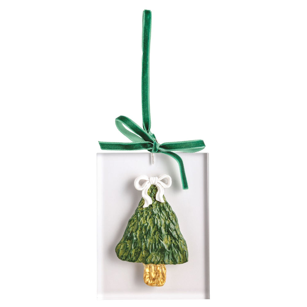 Rectangular acrylic ornament featuring a sculpted green Christmas tree with a gold trunk and white bow, hanging from a green ribbon.