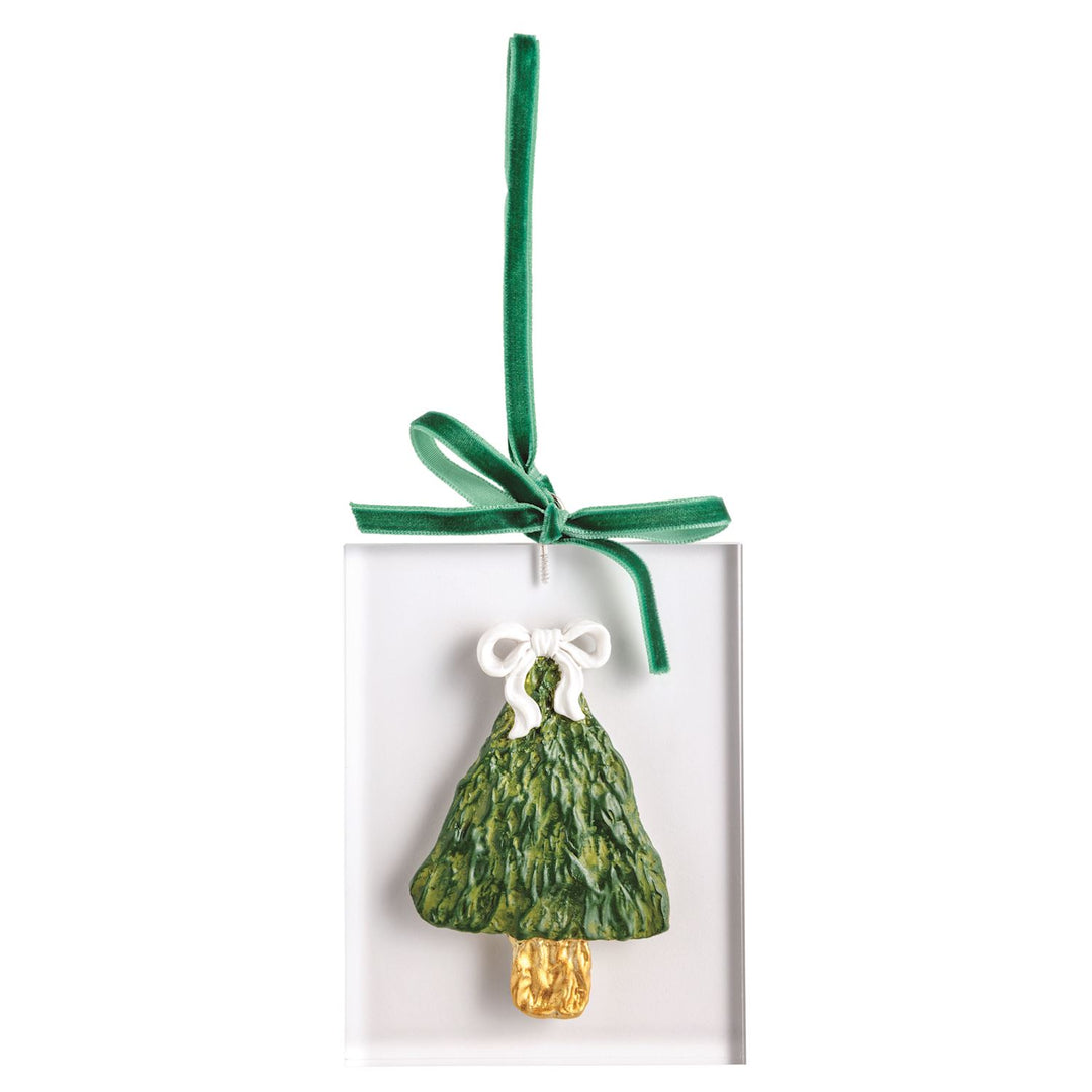 Rectangular acrylic ornament featuring a sculpted green Christmas tree with a gold trunk and white bow, hanging from a green ribbon.