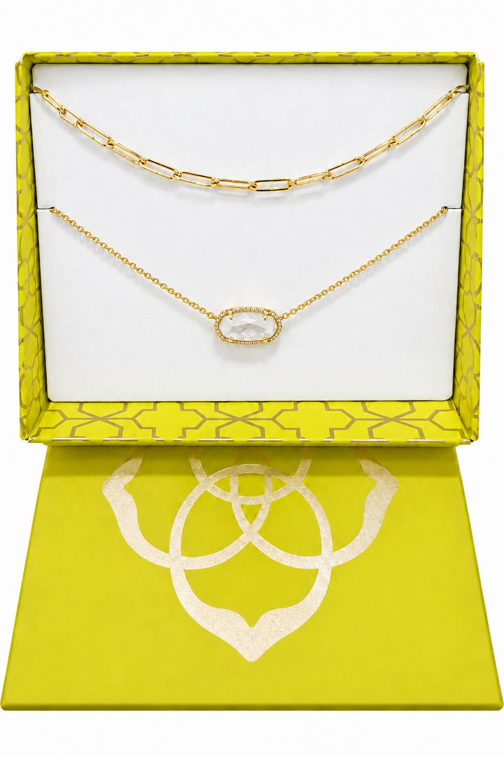 Two gold necklaces with ivory mother of pearl accents in a yellow gift box; available in one size.
