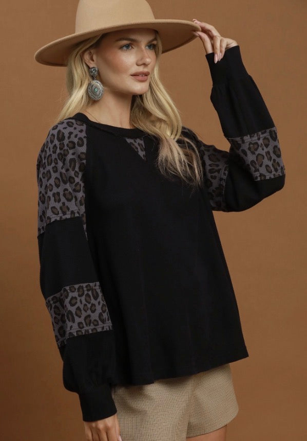 Leopard Mix Thermal Top with black body and leopard print panels on sleeves and shoulders; available in sizes S-XL.