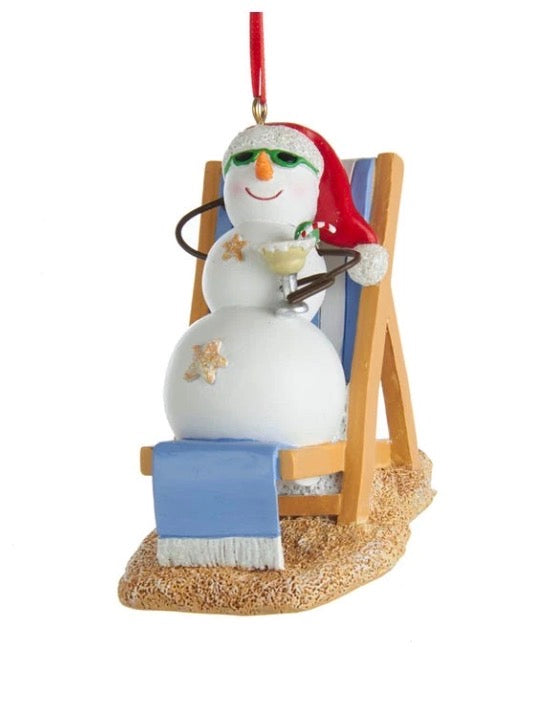 Tanning Snowman Ornament with sunglasses, Santa hat, drink, and starfish.