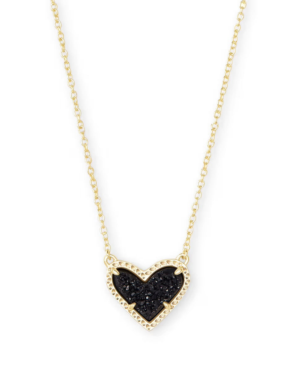 Gold heart pendant necklace with textured black center, beaded gold border. Available in 15", 17", and 19" lengths.
